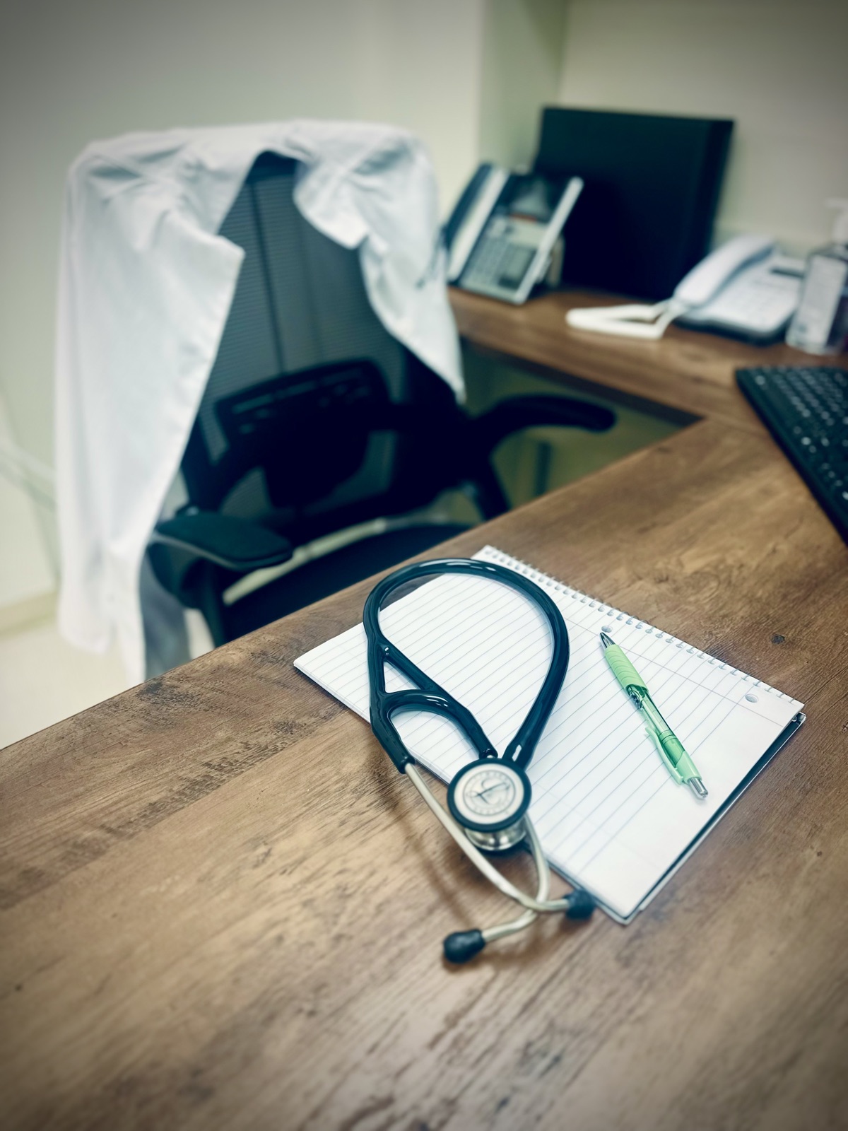 Stethoscope and notepad on the provider's desk